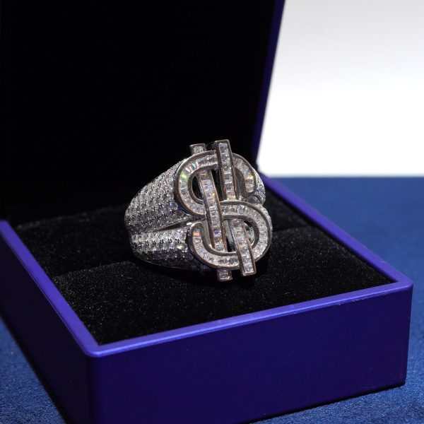 A bold iced-out dollar sign ring Diamond Dancing