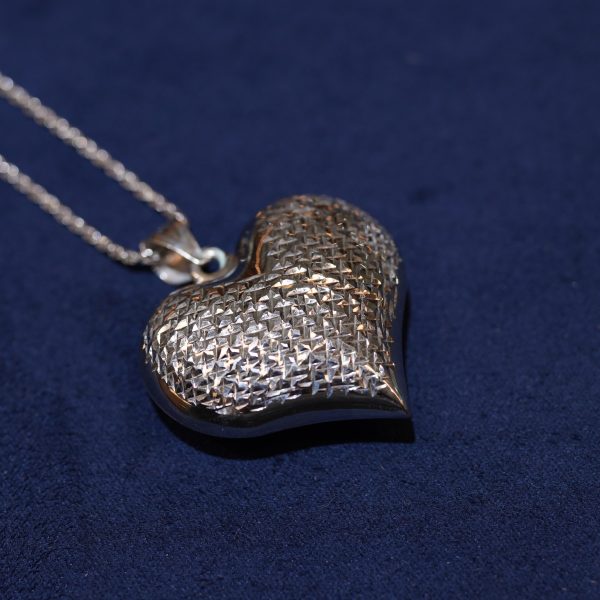 Elegant heart pendant with diamond-cut texture for natural sparkle *( chain are not Including )